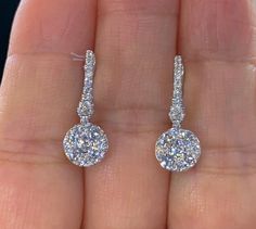 Beautiful Diamond Drop Earrings set with white and sparkling diamonds.  Just dangle below the lob not too long.  Classy and pretty earring.  The huggie hoop earring fits nice around the lobe.  These earrings you can easily dress up or down in them.  Excellent craftsmanship, all diamonds set smooth.  The cluster round diamond dangle gives the look of a 2 carat diamond solitaire, measures about 8.3mm.  The length measures about 21mm.   Genuine natural round brilliant cut diamonds total weight: 1.3 Real Diamond Earrings, Diamond Drop Earrings, Diamond Drops, Pretty Earrings, Jewelry Business, Real Diamonds, Sparkle Diamonds, Wholesale Jewelry, Unique Earrings