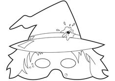 a mask with a witch hat on it and a spider crawling in the middle of it