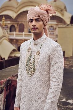 White sherwani with rose gold zari, dabka, beads and crystals embroidery. Paired with a solid kurta and a co-ordinating churidar. - Aza Fashions Traditional Meenakari Sherwani For Eid, Elegant Meenakari Kurta For Diwali, Festive Wedding Sherwani With Meenakari, Traditional Festive Sherwani With Meenakari, Festive Sherwani With Meenakari And Traditional Drape, Traditional Meenakari Sherwani For Festive Occasions, Wedding Kurta With Meenakari For Eid, Eid Wedding Kurta With Meenakari Details, Crystal Embroidery