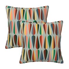 two pillows with colorful shapes on them