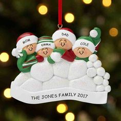 a family ornament hanging from a christmas tree