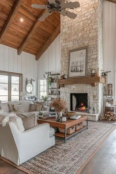 a living room filled with furniture and a fire place in the middle of a room