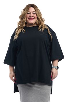 The Esteez black oversized Tunic Tee is a modest loose fitting casual high-low top. It hangs straight down from the shoulders, and is appropriate for all sizes and body types. Made of our very own soft blend of cotton and spandex, its a simple T shirt that can look good with a pencil skirt, jeans or leggings. Modest / tznius casual hi-low Crew neck pull-on closure Loose 3/4 sleeves cover elbows Long enough to cover your backside Opaque - does not require a shell Do not size up as this is an over Oversized Half Sleeve Tops For Fall, Oversized Black Plain Top, Oversized Casual T-shirt With 3/4 Sleeves, Black Oversized Top With 3/4 Sleeves, Black Cotton T-shirt With 3/4 Sleeves, Oversized Black Top With 3/4 Sleeves, Everyday Relaxed Fit Top With 3/4 Sleeves, Black T-shirt With Shirttail Hem For Spring, Basic Black Oversized Tops