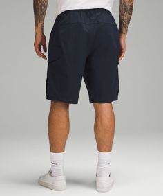 Stow and go. These pull-on cotton-blend shorts have spacious cargo pockets for your wallet, phone, and even a snack or two. Designed for Casual. Roomy fit through glutes and thighs. Cargo pockets with snap-button closures. Hand pockets with hidden phone sleeve. Elasticated waistband has an internal drawcord to adjust the fit. This garment was treated with No-Stink Zinc to inhibit the growth of odour-causing bacteria on the fabric. Lululemon Shorts With Pockets For Summer, Lululemon Summer Bottoms With Pockets, Lululemon Casual Bottoms With Side Pockets, Sporty Lululemon Shorts With Pockets, Lululemon Sporty Shorts With Pockets, Lululemon Casual Blue Bottoms, Lululemon Cotton Bottoms With Pockets, Functional Lululemon Bottoms With 5-inch Inseam, Functional Lululemon Bottoms With Pockets