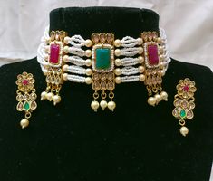 Description Welcome to M S Collections. This is a set of Kundan Necklace Earrings With Gold Plated finishing. This beautiful set can be worn at any occasion such as party, engagement wedding ceremony. Necklace Length - 5 Inches Earrings Length - 2 Inches  Free Shipping Service - Indian Postal Service Delivery Timing -  8 To 18 Days Express shipping option is also given with each listing to get your item fast. Do contact me if there is any query. Happy Buying :) White Bridal Necklace With Matching Earrings For Party, White Hand Set Jewelry For Celebration, White Jewelry Sets For Celebrations, White Hand-set Bridal Necklace For Party, Hand Set White Bridal Necklace For Party, White Choker Jewelry Sets For Party, Hand-set White Bridal Necklace For Party, Festive White Jewelry Sets For Party, White Hand Set Jewelry For Party