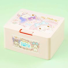 a small pink box with an image of two cats on the front and one cat on the back