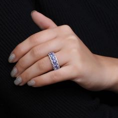 Complement your sophisticated style when you wear this dreamy blue tanzanite and white lab-created zircon scallop border seven-stone ring. Crafted in sterling silver This choice glistens with a row of 4.0mm round violet-blue tanzanites. Scalloped ribbons of white lab-created zircons border the center in shimmer. Diamond White Tanzanite Round Jewelry, Bezel Set Tanzanite Jewelry For Anniversary, Diamond White Jewelry With Round Tanzanite, Anniversary Tanzanite Jewelry With Bezel Setting, White Lab, Blue Tanzanite, Sophisticated Style, Stone Rings, Sterling Silver Rings