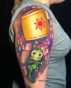 a woman with a tattoo on her arm that has an image of a green lizard