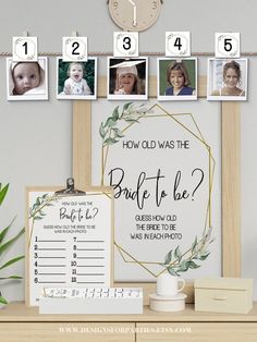 a wooden table topped with pictures and a clock