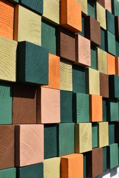 colorful wood blocks are arranged on the wall