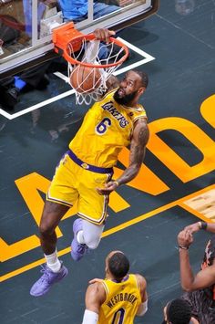 a basketball player dunking the ball into the hoop