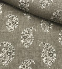 an image of a fabric with paisley designs on the top and bottom half of it