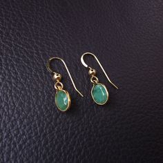 "Genuine, Bezeled Colombian Emerald Earrings DESCRIPTION Beautiful, vibrant green Emerald Gemstones with unique rustic markings and brilliant sparkle. Displayed in an elegant bezel design setting of your choice of metal: 14k Gold Filled or 925 Sterling Silver. Suspended graciously from french ear wire with shiny gold ball accent matching metal. Perfectly dainty and elegant yet noticeable enough to be seen shimmer from across the room. EMERALD DETAILS * Genuine Rustic Emerald Earrings {2 size opt Green Gemstone Drop Earrings, Green Gemstone Drop Crystal Earrings, Green Earrings With Natural Stones As Gift, Handmade Drop Earrings For May Birthstone, Handmade Round Emerald Earrings, Green Birthstone Drop Earrings, Oval Green Earrings With Natural Stones, Green Oval Earrings With Natural Stones, Handmade Emerald Teardrop Earrings