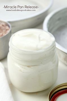 a jar of cream sitting on top of a table