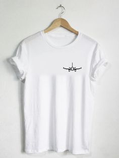 AIRPLANE All tees are handmade in my studio in Los Angeles, California, USA. Please refer to image pictures in listing for size and color charts. Tees are made with preshrunk 100% ringspun cotton (heather grey comes in a cotton/poly blend), are super soft, & design is INK TO GARMENT. Tees can withstand many washes in all wash temperatures and drying levels. We have larger sizes available if needed beyond XXL as well as other shirt colors available, just message us and we can accommodate you Pre-shrunk White Print Crew Neck Shirt, White Print Crew Neck Shirt With Logo, Casual White Cotton Transfers, Cotton Shirt With White Sublimation Print, White Print Graphic Tee With Crew Neck, White Cotton Shirt With Sublimation Print, White Print Crew Neck Shirt With Front Print, White Printed Crew Neck Shirt With Front Print, Casual Crew Shirt With Letter Print