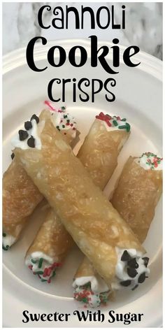 a white plate topped with candy canes covered in frosting