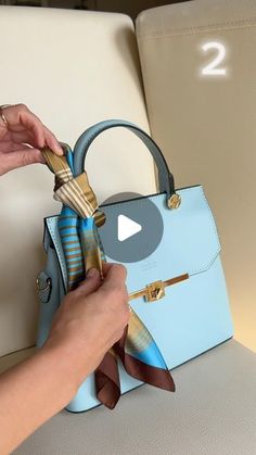 Katerina | DIY on Instagram: "Three ways 👜 to tie a scarf on a bag. Which one do you like more 1,2 or 3?   #tutorial#silkscarf#scarfonthebag#bag#scarfstyle#scarf#silkscarfstyling#fashionstyle#fashion#bagstyle#diy#diytutorial#diyblog#tutorialvideo#bagstyles#diy" How To Tie Scarf On Handbag, Tie Scarf On Purse, Tying A Scarf On A Purse, Purse Scarf Ideas, Scarf Wrapped Purse Handle, Scarves On Bags, Tie Scarf On Bag, Purse Scarf How To Tie A, How To Tie Scarf On Bag