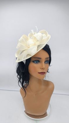 Beautiful ivory  sinamay Fascinator. Sinamay ivory for all occasions- Bridesmaids Hat Kentucky Derby Cocktail Party Tea Party Guest Easter and so on. - Ready to ship - Fast Shipping - Free Shipping - Group discount availalble - Customize by adding different color flowers and or feathers Check my store for more styles and colors.  Hatsandpearls.etsy.com Find more at my website for more styles: www.hatsandpearls.com  Reach out to me if you can't find what you are looking for.  I can make cake custom orders and help you style and match your outfit  Tag and share your pictures when you wear and style our hats.  Instagram: @hats_pearls Facebook: Hats Pearls Thank you for visiting! Fitted Cream Hat For Ceremony, Cream Fitted Hat For Ceremony, Elegant Cream Costume Hats And Headpieces For Ceremony, Cream Mini Hats For Summer Ceremonies, Cream Mini Hat For Summer Ceremony, Cream Mini Hat For Summer Ceremonies, Summer Ceremony Cream Mini Hats, Cream Fascinator For Kentucky Derby Ceremony, Cream Hat For Royal Ascot Ceremony