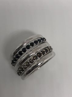 Unusual Deep Toned Blue Sapphire and topaz set in 925 sterling silver Size 7 Can be resized, my jeweler uses a laser and charges a $10-$20 fee All rings are shipped free in the US in a nice gift box. Check out our over a THOUSAND great reviews Engraving is $4 per letter and is not always perfect depending on the piece. It can take a few days if the jeweler is busy. This is payable to Paypal Judithsltd@gmail.com Silver Wide-band Jewelry With Gemstones, Silver Wide Band Jewelry With Gemstone, Silver Sapphire Ring For Jewelry Making, Formal Silver Stackable Sapphire Ring, Silver Stackable Round Sapphire Ring, Gift Sapphire Ring Channel Set In Sterling Silver, Silver Sapphire Ring Channel Set For Anniversary, Elegant Silver Sapphire Ring With Channel Set, Sterling Silver Channel Set Rings