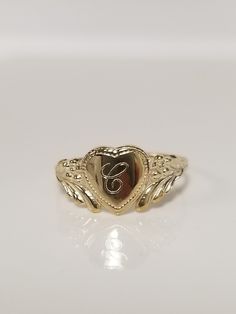 "Thanks for shopping our vintage estate store. We tend to sell well below wholesale and truly hope you enjoy all of our items. Many of the items are one of a kind, so please enjoy scrolling through the pictures and hopefully something will catch your eye. Brown spots are from camera or reflections. Estate 10k yellow gold monogram cursive capital C heart ring. Custom made ring for our shop. Ring size: 3 Setting: 7.5mm 1/4\" to 3/8\" Band width: 1.4mm Weight: .87 gram Marked 10k and it's sweet. On C Ring, Vintage Engraved Initial Ring For Promise, Engraved Vintage Initial Ring For Promise, Classic Heart Shaped 14k Engraved Ring, Classic Engraved Heart Ring Stamped 14k, Vintage Jewelry With Initials For Promise Ring, Heirloom Engraved Heart Ring, Personalized Gold Heart Cut Rings, Personalized Gold Heart Ring For Anniversary