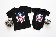 Fumble through the first birthday celebrations with these fun Football Family Shirts! Kick-start your little one's special day with an outfit that will make your family blitz the competition. Score major cuteness points with these snazzy shirts, the perfect addition to your touchdown celebration! 100% combed ringspun cotton fine jersey Want to personalize the back ? Here's the link to add it on https://www.custombuffalochic.com/products/name-on-the-back-upgrade ORDER INSTRUCTIONS: Add each shirt Family Matching Cotton Tops For Game Day, Playful Black T-shirt For First Birthday, Playful Black Top For First Birthday, Playful Black Tops For First Birthday, Black Team Spirit Tops For Birthday, Customizable Cotton T-shirt For First Birthday, Customizable Team Spirit Tops For Birthday, Birthday Football, Football Family