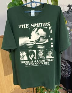 The Smiths Gift Shirt, There is A Light That never Goes Out ,The Smiths tshirt, The Smiths music, The Smiths tee Gift for fans Comfort color ABOUT MATERIAL: Comfort Colors® 1717 Made with medium fabric (6.1 oz/yd² (206.8 g/m consiting of high quality, 100% ring-spun US cotton for long-lasting comfort. The relaxed fit keeps the wearer comfy in both casual and semi-formal settings while the crew neckline delivers that classic, neat style which makes it perfect for accessorizing. What's more, the pre-shrunk fabric ensures a consistently great fit. Made using 100% US cotton that is ethically grown and harvested. Gildan is also a proud member of the US Cotton Trust Protocol ensuring ethical and sustainable means of production. How to wash Comfort Color :Machine wash: cold (max 30C or 90F); Do n The Smiths Band Tee, Aesthetic Band Tees, Green Band Merch T-shirt, Green Graphic Tee For Concert, Green Concert T-shirt With Screen Print, The Smiths Tshirt, The Smiths Merch, The Last Of Us Shirt, The Smiths Shirt