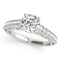 a white gold engagement ring with diamonds on it