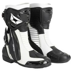 a pair of black and white motorcycle boots