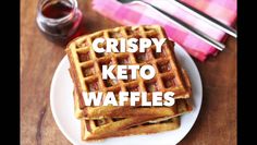 two waffles on a plate with the words crispy keto waffles