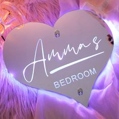 a heart shaped sign with the name ann's bedroom written in cursive writing