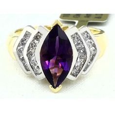 Carat: 10k Yellow Gold (Not Plated) Shape: Marquise Net Weight: 2.65 Grams Finger Size: 7.5 Gem Type: 1 Genuine Amethyst - 1.98 Carats Amethyst Grades: Hue . . . Purple Tone . . . Medium Dark Saturation . . . Vivid No Inclusions Or Flaws 20 Genuine Diamonds - 0.43 Carats Diamond Grades: Clarity Grade . . . Si1 Color Grade . . . G Cut . . . Excellent Type Of Setting: Prong Dimensions: 10 Mm X 5 Mm - Gemstone Measurements 14k Gold Purple Ring With Diamond Accents, Purple Diamond Ring In 14k Gold For Anniversary, Purple Diamond Cut Amethyst Ring For Anniversary, Purple 14k Gold Ring With Diamond Accents, Fine Jewelry Marquise Purple Amethyst Ring, Fine Jewelry Purple Marquise Amethyst Ring, Anniversary Purple Diamond Ring Vvs Clarity, Anniversary Purple Diamond Ring With Vvs Clarity, Purple Amethyst Ring With Accent Stones Marquise Cut