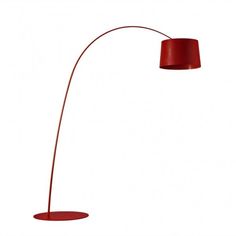 a red floor lamp on a white background with the shade off and one light turned on