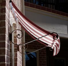 an awning on the side of a brick building