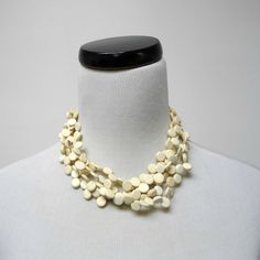 Beads:: Coconut Shell Condition: New, Old Stock Length:: 17" (19.25" Includes Extension Chain) Lobster Claw Closure (Internal Use Only: Xy-? // J22 - C.Nh.Nm // B.J22j /T0.8) White Jewelry With Wooden Beads, White Jewelry With Round Wooden Beads, White Wooden Beads Necklace For Gift, Elegant White Jewelry With Wooden Beads, Cream Necklaces With Round Beads For Jewelry Making, Cream Jewelry With Large Beads As A Gift, Cream Jewelry With Large Beads For Gift, Elegant White Necklaces With Wooden Beads, Elegant White Beaded Necklaces With Wooden Beads