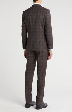 Classic notched lapels smarten the jacket of this trim-fit suit paired with flat-front trousers and finished in a handsome plaid print. 35 1/2" inseam; 10 1/2" rise (size 40R) Jacket has notched lapels; chest welt pocket; front flap pockets Unhemmed Lined 90% wool, 10% polyester Dry clean Imported Plaid Suit With Concealed Placket And Lapel Collar, Tailored Plaid Suit With Notch Lapel, Tailored Plaid Suit With Concealed Placket, Plaid Suit With Suit Collar For Work, Semi-formal Plaid Suit With Notch Lapel, Plaid Suits With Welt Pockets And Lapel Collar, Plaid Suits With Welt Pockets, Plaid Notch Lapel Suit For Business Casual, Fitted Plaid Blazer With Welt Pockets