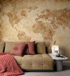 a living room with a couch and a map on the wall