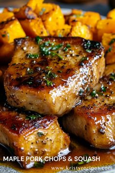 pork chops and squash on a plate with parsley sprinkled on top