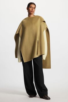 WOOL-BLEND CAPE - Light brown - Outdoor layers - COS Chic Oversized Cashmere Cape, Oversized Chic Wool Poncho, Chic Oversized Cape With Batwing Sleeve, Oversized Cashmere Cape With Long Sleeves, Chic Shawl Cape For Fall, Chic Long Sleeve Cape For Layering, Cashmere Cape For Layering In Fall, Cashmere Cape For Fall Layering, Fall Cashmere Cape For Layering