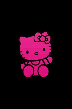 a pink hello kitty sitting on top of a black background