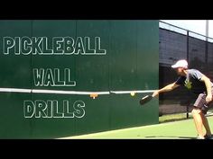 a man hitting a tennis ball with a racquet on a court that says pickleball wall drills