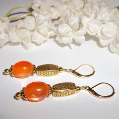 Dangle & Drop Earrings Beaded Orange Set Nwt Gift Idea For Her Girl Woman 5124 This Beaded Earring Set Is Brand New (Nwt) And Handmade By Me - Wvluckygirl. Handcrafted With Orange Acrylic Cat's Eye Beads That Shimmer And Change Hues In The Light. The Pair Also Have Gold Toned Costume Jewelry Beads Which Were Antiqued In Black. They Dangle & Drop From Lever Backs For Women's Pierced Ears. Measure 2 Inches Tall & 3/8 Inch Wide. Each Single Earring Weighs 2.7 Grams. You Will Love The Way The Beads Elegant Handmade Orange Beaded Earrings, Handmade Elegant Orange Beaded Earrings, Elegant Orange Beaded Earrings As A Gift, Elegant Orange Beaded Dangling Earrings, Beaded Orange, Purple Dangle Earrings, Blue Beaded Earrings, Animal Print Earrings, Gold Bead Earrings