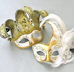 White Gold Masquerade Mask Jolly Jester Mask Feather Mask | Etsy Gold Mardi Gras Mask Costume Accessories, Elegant White Masquerade Mask For Mardi Gras, White Adjustable Masks And Prosthetics For Masquerade, Adjustable White Masks And Prosthetics For Masquerade, White Party Mask Costume Accessory, White Mardi Gras Masquerade Masks, Gold Mardi Gras Eye Mask, Gold Costume Accessories For Carnival Masquerade, White Masquerade Masks And Prosthetics For Mardi Gras