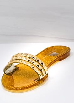 Aria B Dark Gold Slides - Women’s Flat Slide-On Sandals in Dark Gold. Get ready for this triple threat! Featuring three skinny straps detailed with minimalist pyramid studs, the Aria B black slides are a great addition to our sisterhood of traveling sandals (and your growing sandal collection). With its easy slide-on construction, the Aria B Black Slides are great for slipping on and off by the beach, pool, or garden patio. Take these around the world, or just to your favorite local coffee shop. Gold Studded Open Toe Sandals, Gold Studded Sandals For Summer, Summer Gold Sandals With Gold Studs, Summer Party Sandals With Studs, Casual Sandals With Gold Studs For Summer, Casual Gold-studded Sandals For Summer, Trendy Gold-studded Open Toe Sandals, Flat Sandals With Spikes For Party, Summer Beach Sandals With Gold Studs