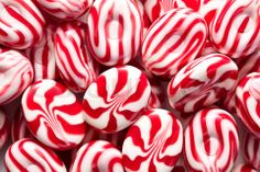 red and white candy canes are piled together