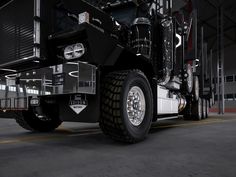 a large semi truck parked in a garage