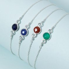 "Strung on a delicate double chain, the Hint of Color Gemstone Bracelet adds just the right slip of color to your wrist and is a great birthstone gift. The bracelet comes in Silver or Gold. Metal: Sterling Silver Chain & Pendant, Gold-filled Chain & Vermeil Pendant Measurements: 6\" or 7\", please indicate what size you need at the checkout so we can ship accordingly. Have a question? Need a custom length? Ask us" Hypoallergenic May Birthstone Bracelets, Hypoallergenic May Birthstone Bracelet, Adjustable Birthstone Chain Bracelet Gift, Adjustable Gemstone Chain Bracelet With Round Shape, Adjustable Gemstone Chain Bracelet, Minimalist Adjustable Chain Bracelet With Birthstone, Adjustable Round Gemstone Chain Bracelet, Minimalist Adjustable Birthstone Chain Bracelet, Chain Bracelet With Birthstone As Gift