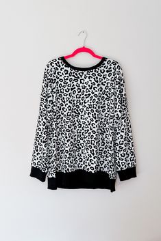 Stay cozy and wild in this Cheetah Print Jersey Knit Pullover Sweatshirt! The classic design - with a contrast neckline and cuffs - makes this a timeless addition to your wardrobe. Layer it with your favorite cold weather looks and express your wild side! Jersey Knit Crew Neckline Banded Cuff Side Slits Relaxed Fit 95% Polyester, 5% Elastane True to Size >> Approximate Measurements << S: Chest 40" Length 25"M: Chest 42" Length 26"L: Chest 44" Length 27"XL: Chest 46" Length 28"2XL: Chest 49" Length 29"3XL: Chest 52" Length 30" Model Sarah Measurements: 5’ 4”, Bust 34", Waist 24", Hips 34" Typically wears a size Small & 0. Wearing a size S here. Model Kylie Measurements: 5’ 5”, Bust 48", Waist 42", Hips 54" Typically wears a size 2XL & size 16W. Wearing a size 2XL here. Traci (that’s me with Leopard Print Crew Neck Top For Winter, Trendy Leopard Print Crew Neck Sweater, Leopard Print Long Sleeve Sweater, Oversized Leopard Print Tops With Long Sleeves, Casual Leopard Print Long Sleeve Sweater, Casual Long Sleeve Leopard Print Sweater, Dress Layer, Swimwear Sets, Denim Leggings