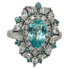 In a beautiful platinum setting, a gorgeous Pear-shaped Paraiba is surrounded by lovely diamonds. This was accented by a gorgeous pure Pear Paraiba. The ring is a real spectacle. ***** Details: ►Metal: Platinum ►Natural Gemstone: Paraiba ►Gemstone Weight: 1.26 carat ►Gemstone Color: Blue ►Natural Diamonds: 1.85 carat ►Style # TAP106 ►Item No.: 2134 ►Estimated Retail Value: $25000 ***** FAQs: ►Free USA Shipping ►Ring comes with a free gift box ►Please note we cannot accept returns if ring is retu English Jewelry, Bespoke Jewellery, Cocktail Rings, Gemstone Colors, Pear Shaped, Free Gift, Natural Diamonds, Gemstone Jewelry, Metallica