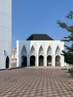 a large white building with arches and windows