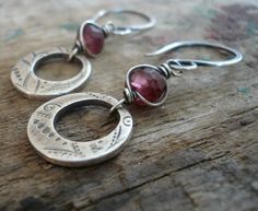 "\"Winterberry\" Earrings COMPONENTS: ~ 4-5mm faceted rondelles of berry pink Rhodolite Garnet that are snugly wrapped with a strand of sterling wire. ~1/2\" (~12mm) organic loops of recycled fine silver (99% pure silver/sterling is 92.5% silver) crafted & imprinted by hand by me so the print will vary by each piece =). My hand formed earwires that I have forged with my favorite hammer to add strength & grace. An oxidized patina was added layer by layer then carefully removed by brushing & polis Earrings Hoops, Fine Silver Jewelry, Silver Jewellery Sets, Handmade Wire Wrapped, Hammered Sterling Silver, Rhodolite Garnet, Handmade Wire, Oxidized Sterling Silver, Fine Silver